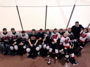Members of the team take a break between periods at the Woodbridge Community Center.