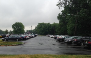 The "senior lot" at Woodbridge High School will receive new signs and numbered spots this summer to ensure students are parking by permit only.