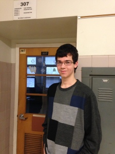 Junior Mehdi Lemdani waits in the hallway for class to begin. (Credit: Brian O'Halloran)