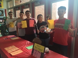 Members of the Chinese Honor Society offer "peace fortunes" during lunch. (Left to right: Juniors Richard Shields, Genaro Prencipe, Christian Pinto, Andrea Umali, and Eric Chan)