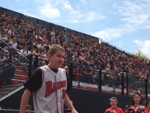 Freshman Ben Lepisto takes the turf at the spring pep rally. Lespisto had recently been diagnosed with a form of brain cancer. (Credit: Brian O'Halloran)